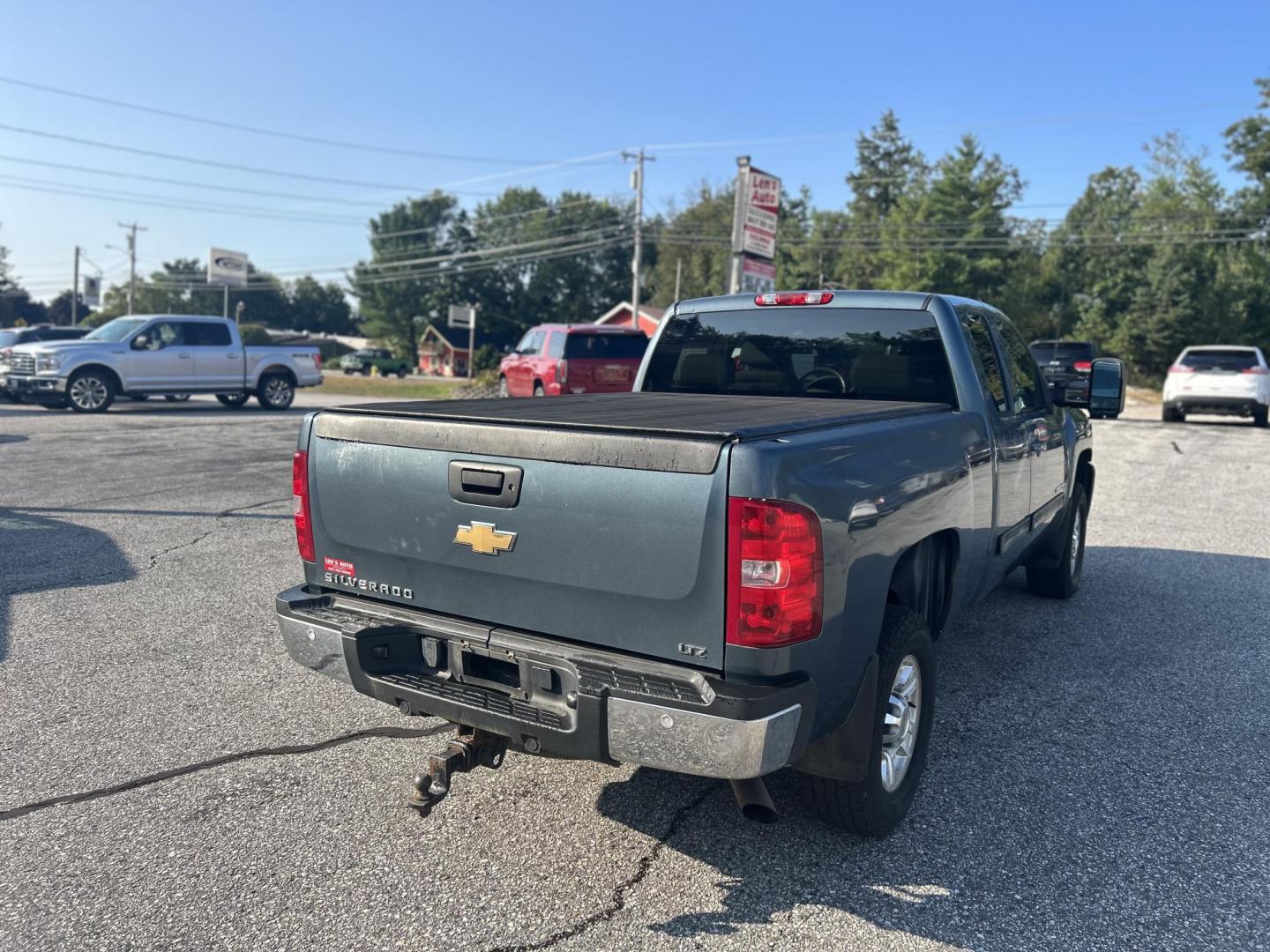 2010 Blue /Tan Chevrolet Silverado 2500HD LTZ Ext. Cab 4WD (1GC5KYBG8AZ) with an 6.0L V8 OHV 16V FFV engine, 6-Speed Automatic transmission, located at 27 Main St., Norway, MD, 04268, (207) 743-0900, 44.199795, -70.530807 - Photo#2