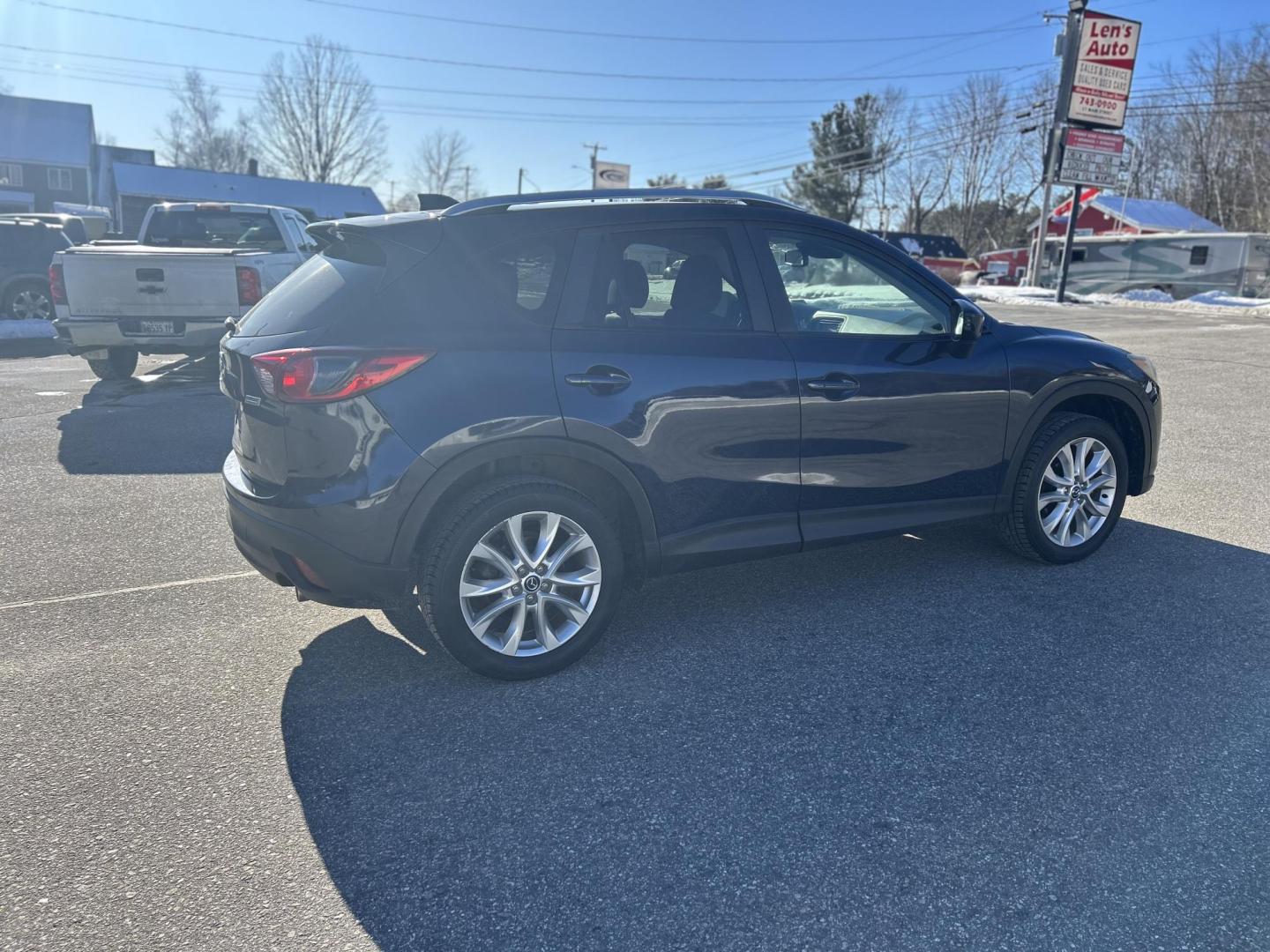 2015 BLUE /Tan Mazda CX-5 Grand Touring AWD (JM3KE4DY2F0) with an 2.5L L4 DOHC 16V engine, 6-Speed Automatic transmission, located at 27 Main St., Norway, MD, 04268, (207) 743-0900, 44.199795, -70.530807 - Photo#2