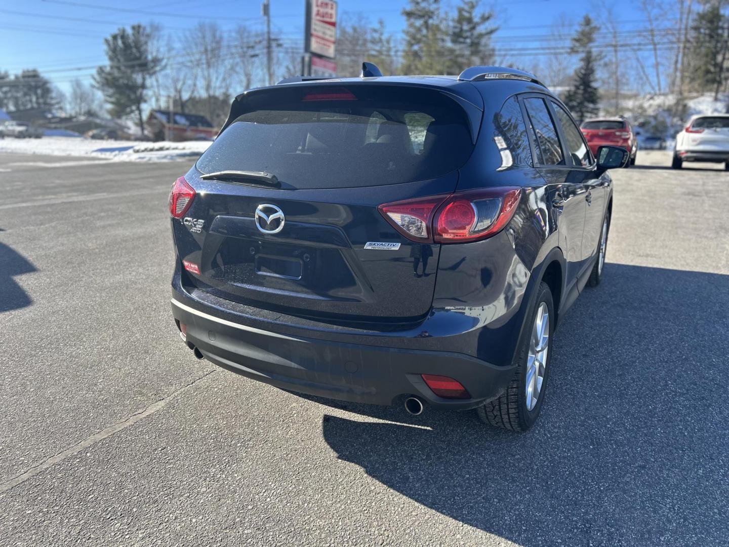 2015 BLUE /Tan Mazda CX-5 Grand Touring AWD (JM3KE4DY2F0) with an 2.5L L4 DOHC 16V engine, 6-Speed Automatic transmission, located at 27 Main St., Norway, MD, 04268, (207) 743-0900, 44.199795, -70.530807 - Photo#3